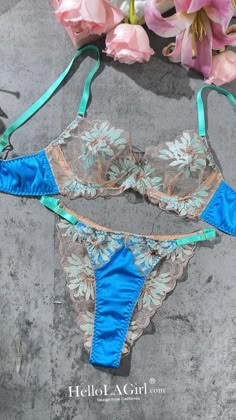 Experience timeless elegance with our vintage-inspired lingerie set. Featuring a peacock blue base adorned with light brown retro floral embroideries, highlighted with silver thread accents, this ensemble exudes classical charm. Elevate your lingerie collection with this sophisticated and captivating set. ✨🌺 Vintage Peacock, Lingerie Party, Blue Lingerie, Pink Lingerie, Intricate Embroidery, Pretty Lingerie, Peacock Blue, Bra And Panty Sets, White Embroidery