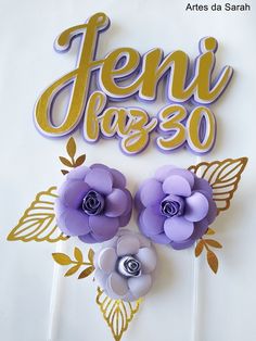 there is a cake topper that has flowers on it and the words feni jago written in spanish