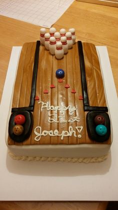 a birthday cake with bowling pins on it