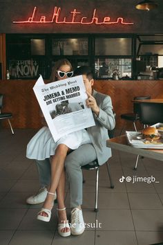 a woman sitting in a chair holding up a newspaper with the caption, daffuthen