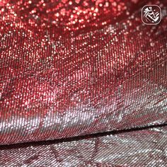 red and silver sequinized fabric close up