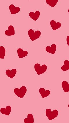 many red hearts on a pink background