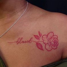 a woman's chest with a rose and the word love tattooed on her left side