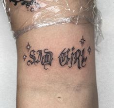 a tattoo that says san diego on the side of a woman's leg, with stars around it