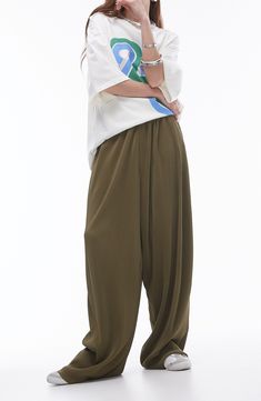 Go for chic volume in these roomy pants cut from gorgeous plissé fabric for textural intrigue. 28" inseam; 20" leg opening; 16" front rise; 19" back rise (size Medium) Elastic waist 100% polyester Machine wash, line dry Made in Turkey Spring Oversized Solid Wide Leg Pants, Spring Oversized Wide-leg Harem Pants, Oversized Wide Leg Harem Pants For Spring, Oversized Wide Leg Parachute Pants For Spring, Baggy Wide Leg Harem Pants With Pull-on Style, Oversized Wide-leg Pants With Elastic Waistband, Loose Fit Wide-leg Pants With Elastic Waistband, Summer Pleated Tapered Leg Pants, Spring Wide Leg Pull-on Harem Pants