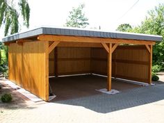 a large wooden building with a metal roof