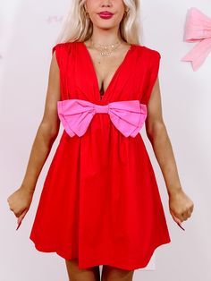 Bow Me Away Red Dress | Sassy Shortcake | sassyshortcake.com Flirty Pink Mini Dress With Bow, Cute Party Mini Dress With Bow, Playful Mini Dress For Party, Playful Mini Length Party Dresses, Flirty Pink Dress With Bow, Pink Sleeveless Mini Dress With Bow Tie Back, Cute Dresses With Bow Tie Back, Red Sleeveless Dress With Bow, Chic Red Mini Dress With Bow