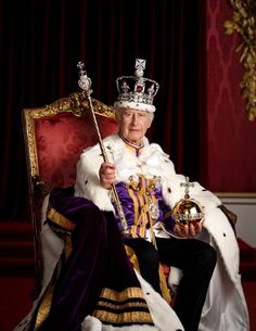 an old man sitting in a chair with a crown on his head