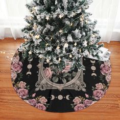 a christmas tree with pink roses on it