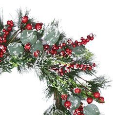 a christmas wreath with red berries and greenery on it, surrounded by snowflakes