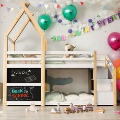 a child's room with balloons and toys on the floor, including a bunk bed