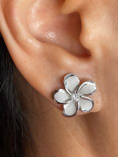 Beautiful Hawaiian 15mm Plumeria Flower with Cubic Zirconia Stud Earrings Solid Sterling Silver with a 925 Stamp Rhodium Finish Plumeria Total Weight 2.4 grams Plumeria Width 15mm Plumeria Length 15mm Amazing Gift For Friends and Family! Comes with Gift Box! Silver Flower Shaped Earrings For Anniversary, Hypoallergenic Flower Shaped Earrings For Anniversary, Silver Earrings With 3d Flowers For Anniversary, White Gold Cubic Zirconia Flower Earrings, Hypoallergenic Flower-shaped Earrings For Anniversary, Hallmarked Sterling Silver Flower Earrings Gift, Plumeria Jewelry, Silver Flower-shaped Fine Earrings, Plumeria Flower Necklace