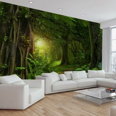 a living room with white furniture and a large mural on the wall that is covered in green trees