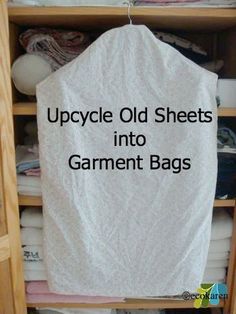 an upcycle old sheets into garment bags hanging on a clothes rack in a closet