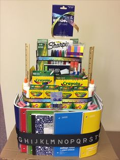 a stack of craft supplies sitting on top of a cardboard box