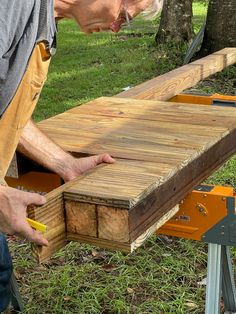 a man working on a piece of wood