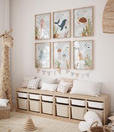 a child's room decorated in neutrals and pastels with pictures on the wall