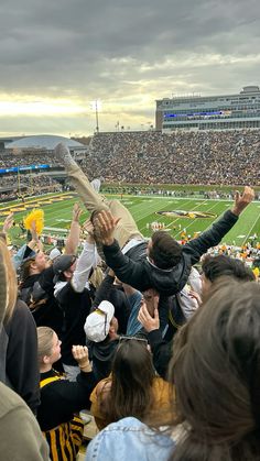 a crowd of people at a football game