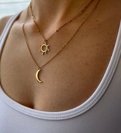 Looking for a radiant piece that effortlessly captures the balance and beauty of day and night? You've found your perfect match with our captivating Sun and Moon Necklace! Crafted with thoughtful details, this harmonious piece offers: A durable and high-quality steel chain, marrying strength with elegance. A stunning sun and moon pendant, skillfully designed to embody the beautiful dichotomy of the celestial day and night cycle. A remarkable choice for daily wear, special occasions, or as a thoughtful gift for someone who appreciates the poetic dance of the sun and moon. The Sun and Moon Necklace isn't just an accessory; it's a wearable testament to the balance of light and dark, day and night, yin and yang. It serves as a beautiful reminder that life is a cycle of highs and lows, each equ Moon Snd Sun Necklace, Celestial Sun And Moon Necklace, Everyday Sun And Moon Design Necklaces, Gold Sun Necklace, Moon Necklace Gold, Sunburst Necklace, Crescent Moon Necklace Gold, Sun And Moon Necklace, Coordinates Bracelet