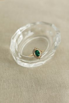 Classic Oval Cabochon Emerald Ring, Heirloom Oval Emerald Ring, Timeless Oval Emerald Ring With Bezel Setting, Elegant Emerald Ring With Oval Cabochon, Classic Oval Emerald Ring With Bezel Setting, Timeless Oval Emerald Ring For Formal Occasions, Heirloom Oval Green Emerald Ring, Heirloom Oval Emerald Ring As May Birthstone, Classic Emerald Ring With Bezel Setting, Oval Cabochon