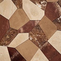 a close up view of some brown and white marble tiles on the floor in an abstract pattern