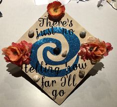 there's just something telling you far all to go on this graduation cap that is decorated with flowers