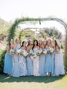 a group of women standing next to each other