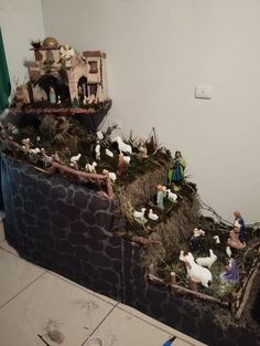 a nativity scene is displayed on a table