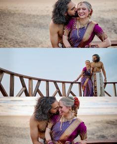 two women in sari are hugging each other on the beach and one woman is smiling