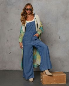 Meet the Nolah Relaxed Chambray Overall Jumpsuit—your go-to for effortlessly chic autumn style. Crafted from lightweight chambray fabric, this jumpsuit effortlessly blends Western ruggedness with Bohemian ease. Features include a practical front chest pocket and side slant pockets, plus adjustable shoulder ties for a perfect fit. Whether exploring fall foliage or lounging around, this jumpsuit offers a relaxed yet refined look that captures the essence of the season. Lightweight chambray fabric Front chest pocket and side slant pockets Adjustable shoulder ties Hidden side zipper closure Unlined 100% Lyocell Chic Denim Blue Jumpsuits And Rompers With Pockets, Denim Blue Bib Front Jumpsuits And Rompers For Spring, Denim Blue Bib Front Jumpsuit For Spring, Casual Wide Leg Loungewear Overalls, Fall Light Wash Jumpsuits And Rompers With Pockets, Chic Non-stretch Cotton Denim Jumpsuit, Medium Wash Overalls For Day Out, Casual Wide-leg Overalls For Loungewear, Spring Jumpsuits And Rompers With Pockets For Day Out