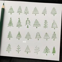 a sheet of paper with christmas trees drawn on it and a pencil next to it