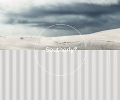 there is a white metal wall with the words southern 6 on it in front of a cloudy sky