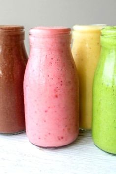 three different types of smoothies are lined up