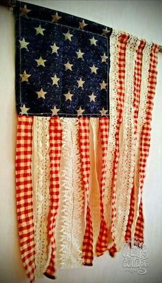 an american flag hanging on the wall with red, white and blue gingham