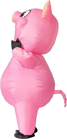 an inflatable pink flamingo with a black bow tie