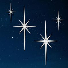 three white stars against a dark blue sky