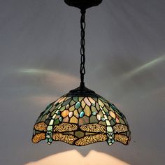 a stained glass lamp hanging from a ceiling