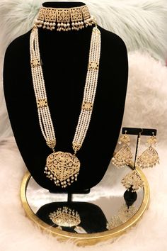 Handcrafted with love to give a real traditional look for this set beautifully studded with jadau stones and pearls give a royal look. Includes: Choker, Rani Haar, Earrings, and Tikka Rampuri Jewellery Set, Rani Set Gold, Moti Rani Haar, Jadau Rani Haar, Rani Haar Gold Design, Traditional Gold Plated Pearl Necklace For Celebration, Traditional Gold-plated Pearl Necklace For Celebrations, Elegant Kundan Traditional Wear For Diwali, Elegant Pearl Jewelry Set With Stone Work