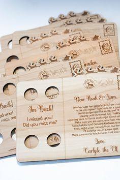 four wooden coasters with different designs and words on them, one is for each family member