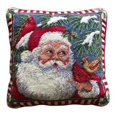 a christmas pillow with santa claus holding a bell