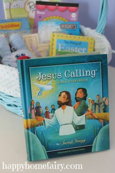 the jesus calling bible storybook sits in front of a basket filled with books