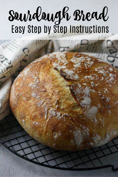 a loaf of sourdough sitting on top of a cooling rack with the words free e - mail series