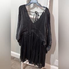 Size 2xl, Black Flowy Style Dress, Hits Right Above Knees, Balloon Sleeves Are Sheer And Elastic Wrist, Elastic Waistband, Plunge Neckline, Has Black Solid Underlining, Ties On Back Of Neck, Fabric Does Tend To Hold Static But It Is Very Cute And I Have Never Worn It Black Mini Dress For Beach In Fall, Bohemian Flowy Mini Dress For Night Out, Bohemian Black Mini Dress For Brunch, Sheer Black Dress, Flowy Black Mini Dress For Day Out, Black Bohemian Mini Dress For Day Out, Casual Black Billowy Dress, Luxury Billowy Black Dress, Black Long Sleeve Fairy Grunge Dress