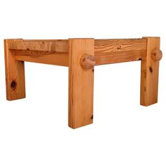 a close up of a wooden bench on a white background