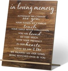 a wooden sign that says in loving memory