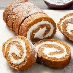 several pieces of cinnamon roll with powdered sugar on top