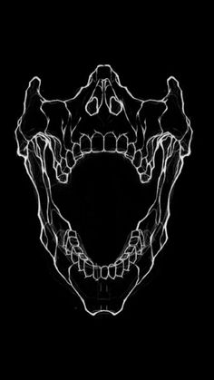 a black and white photo of a skull with teeth in the shape of a heart