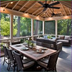 a screened porch with wicker furniture and ceiling fan