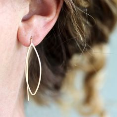 These appealing earrings live in the happy middle point between geometric minimalism and nature inspired design. The long fixed ear wire creates a visual line like the center vein of the leaf, adding dimension and depth to the design. They are wonderfully balanced, and so simple and pretty that you will find yourself reaching for them every morning. 1.5 inch hammered leaf shape dangles with a long fixed ear wire back. Available in sterling silver, 14k gold fill (as shown), or mixed metal. All Rebecca Haas Jewelry is handcrafted by me in my Southern Vermont Studio from recycled and ethically sourced materials. Southern Vermont, The Leaf, Nature Inspired Design, Mixed Metals, Leaf Shapes, Leaf Earrings, Ear Wire, The Happy, Vermont