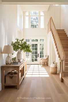 a living room filled with furniture and a stair case